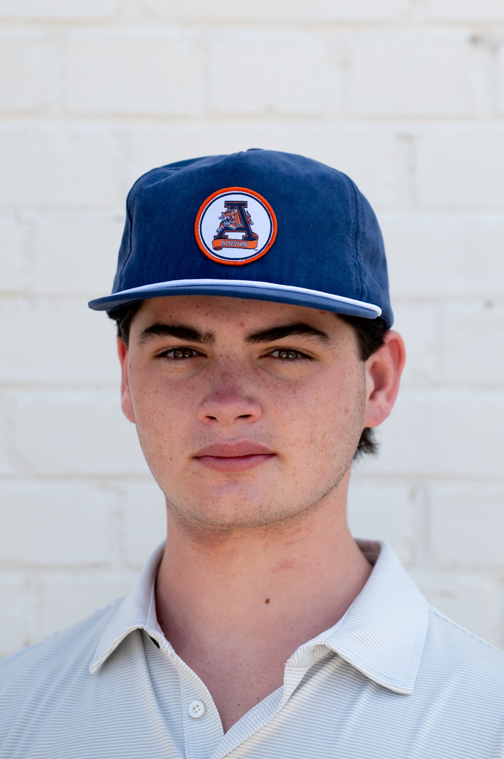 Auburn University Navy Hat with a White rope and a patch of the Leaping Tiger Logo