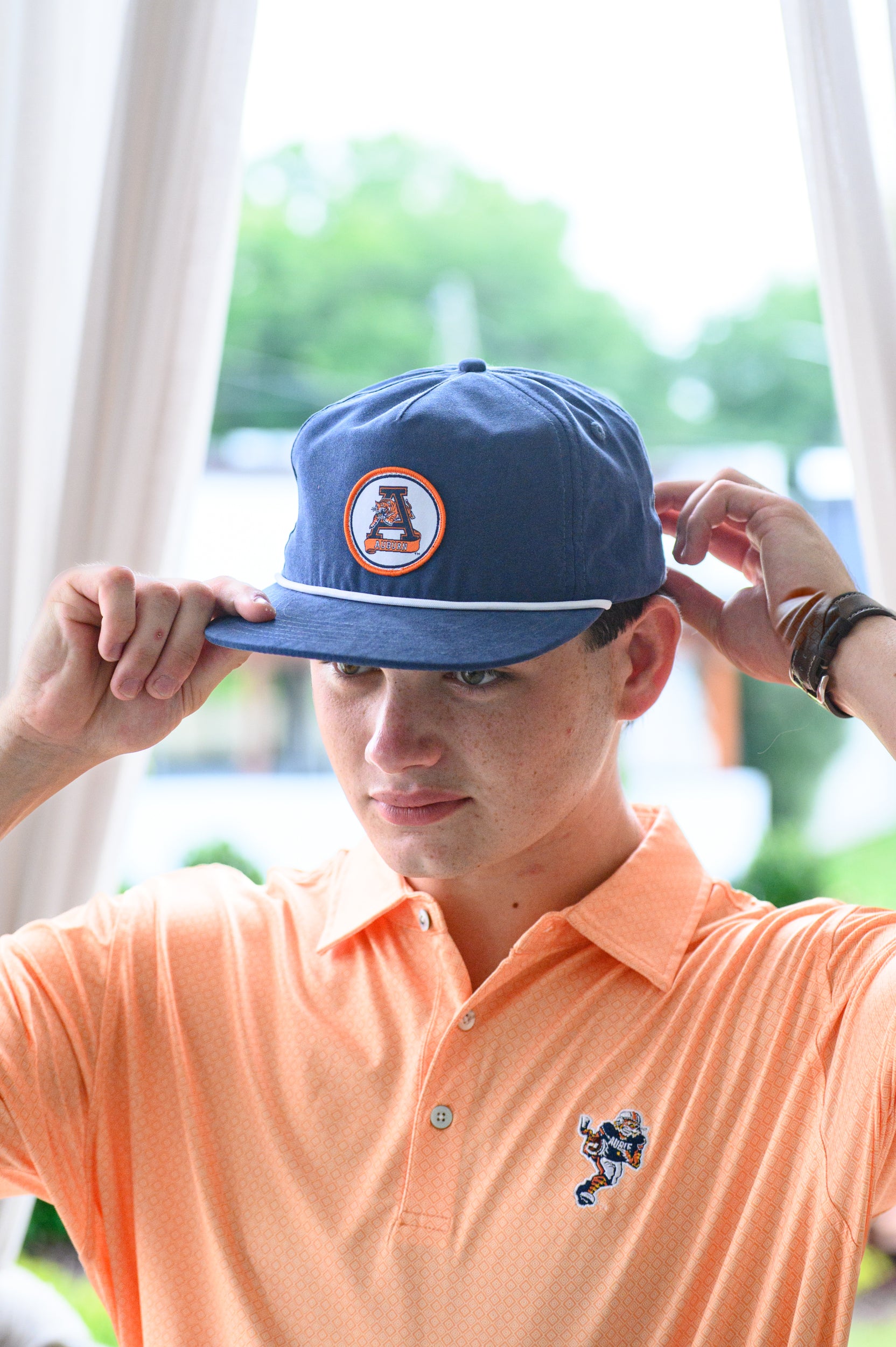 Auburn University Navy Hat with a White rope and a patch of the Leaping Tiger Logo