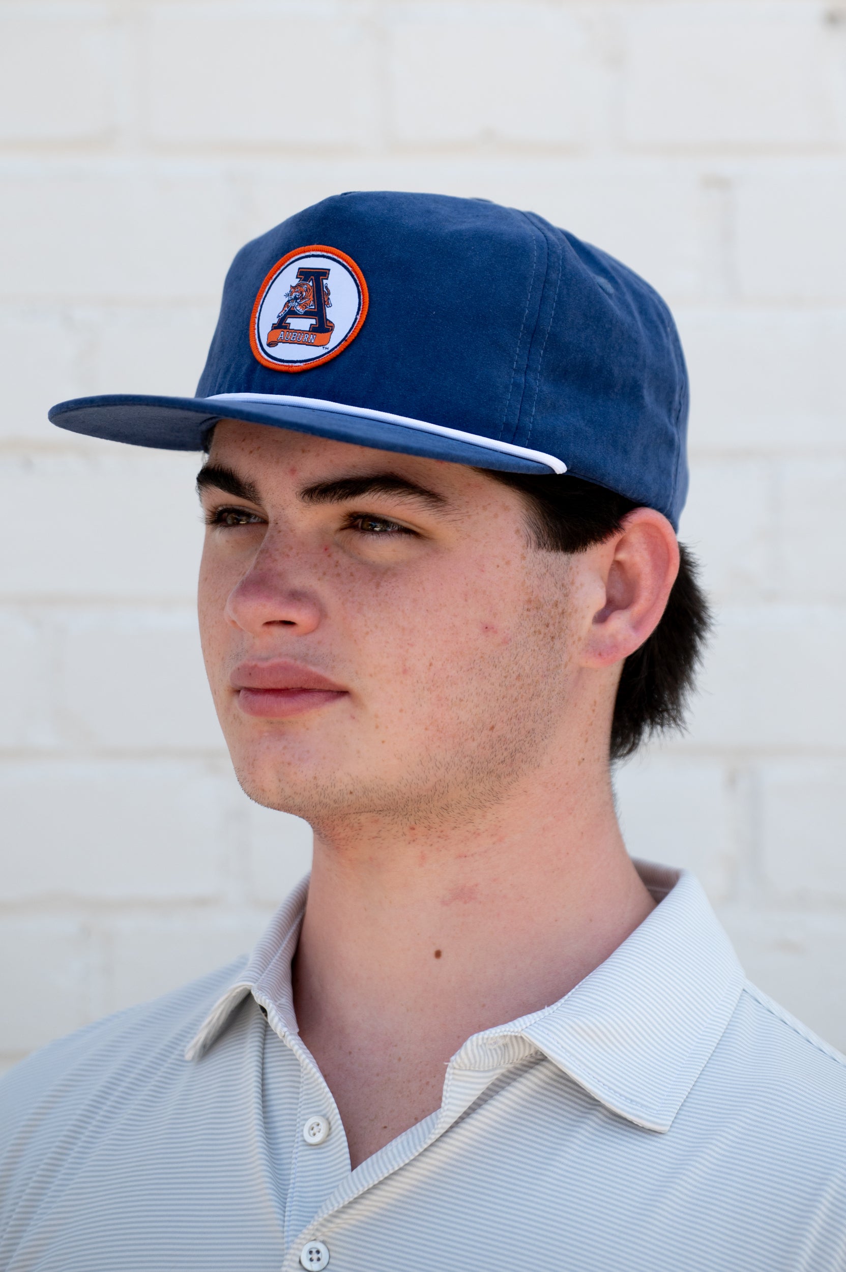 Auburn University Navy Hat with a White rope and a patch of the Leaping Tiger Logo