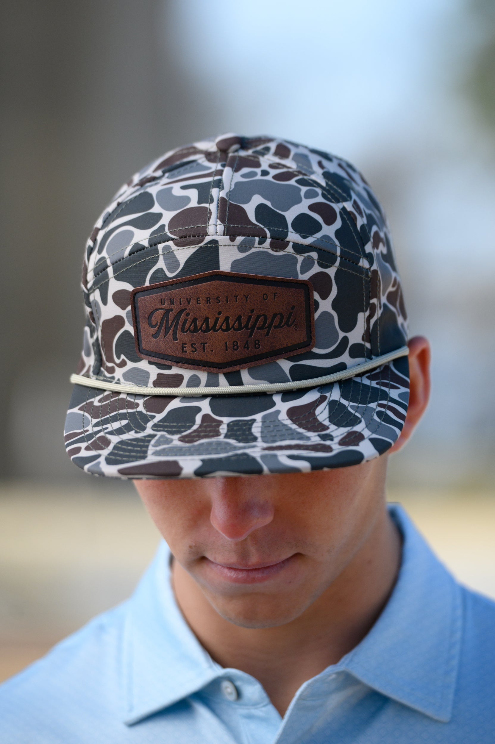 Ole Miss Camo Hat with a Leather patch with text “Mississippi University”