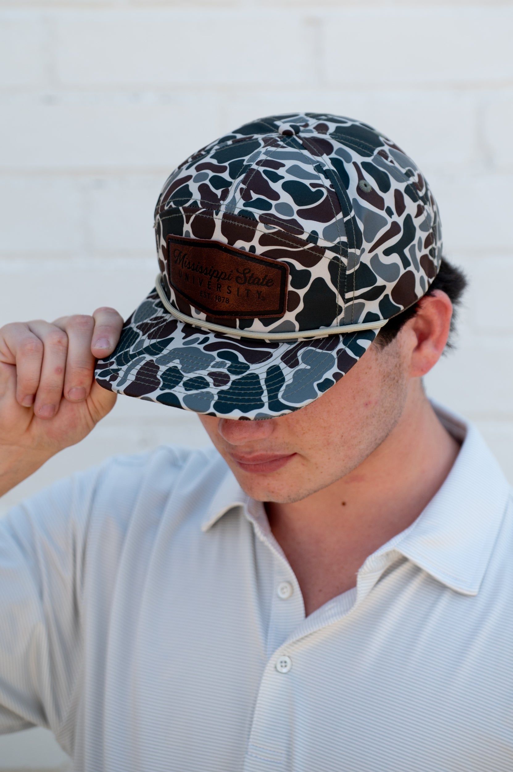 Ole Miss Camo Hat with a Leather patch with text “Mississippi University”