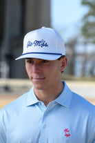 Ole Miss White Hat with Blue embroidery “Ole Miss” with a golf flag representing the “I” in “Miss”