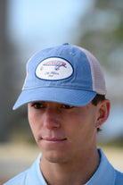 Ole Miss Dusty Blue Hat with a fishing lure with Red script “Rebels”