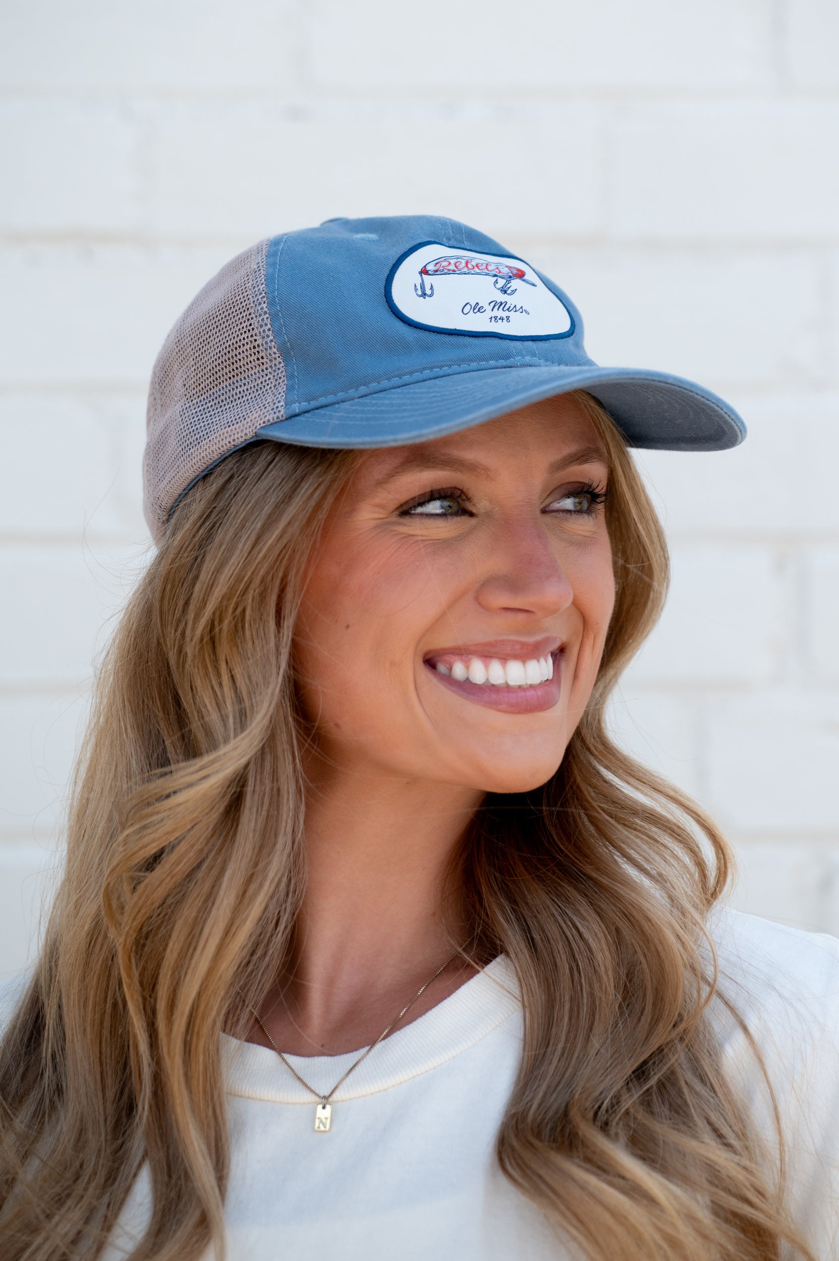 Ole Miss Dusty Blue Hat with a fishing lure with Red script “Rebels”