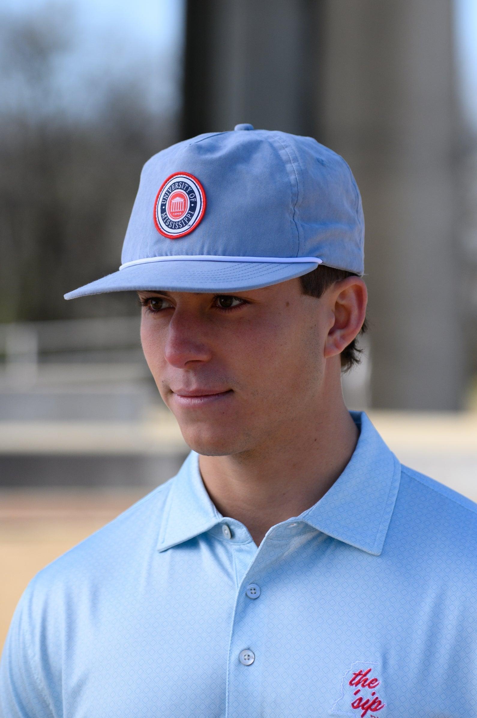 Ole Miss Dusty Blue Hat with a patch of the Ole Miss Seal