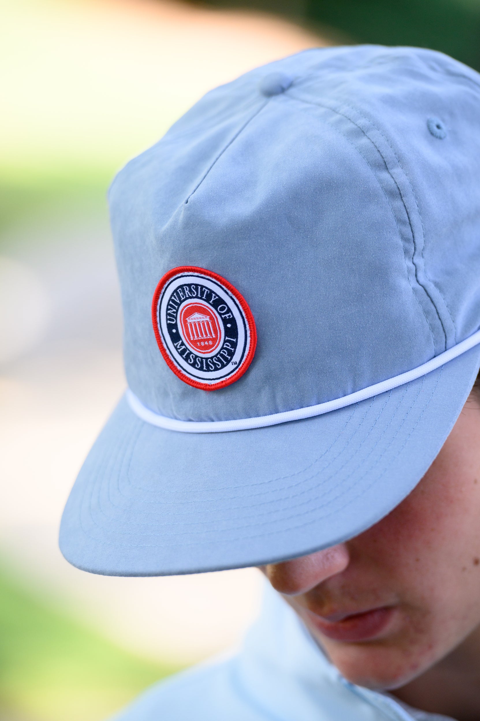 Ole Miss Dusty Blue Hat with a patch of the Ole Miss seal
