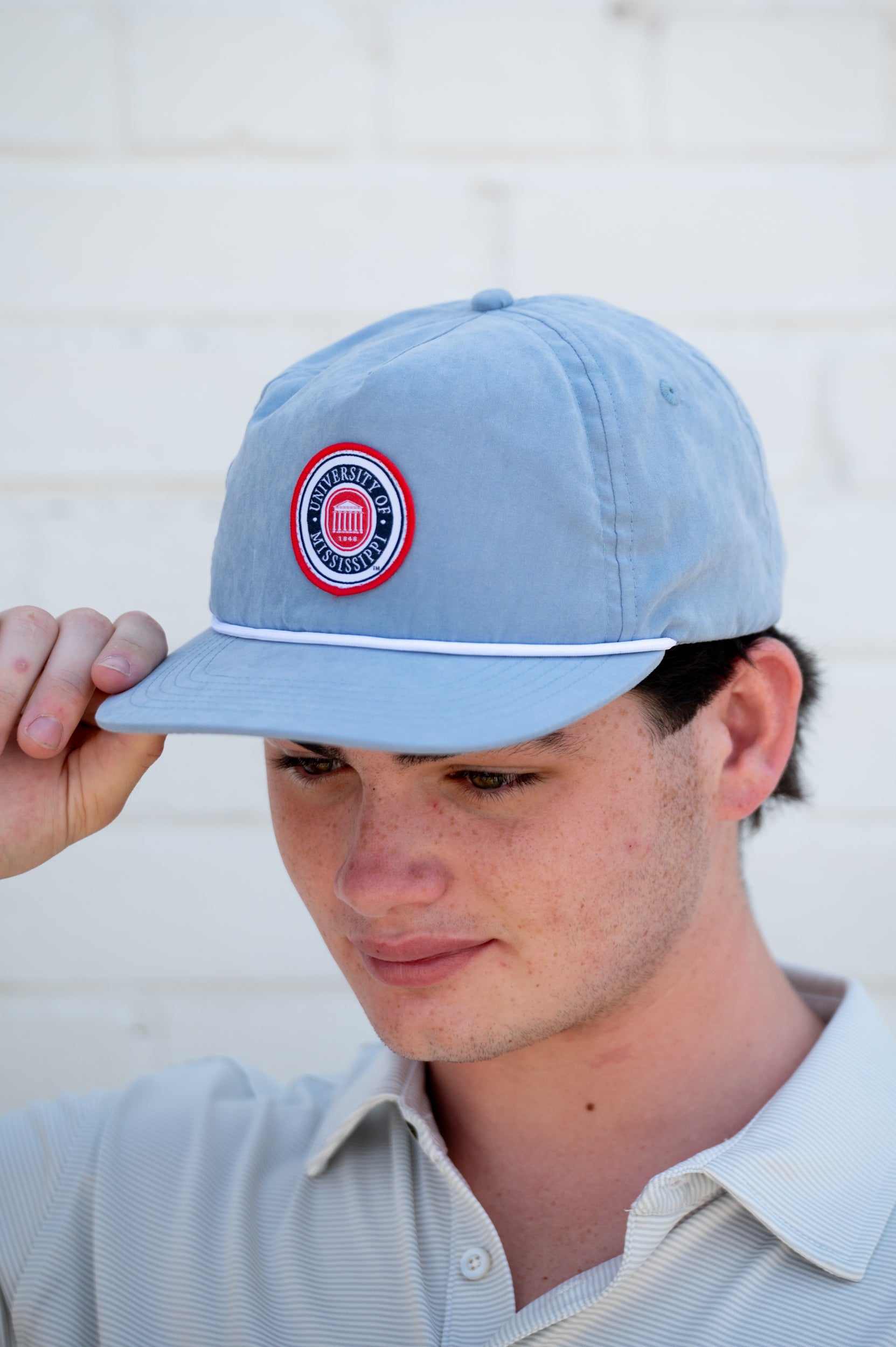 Ole Miss Dusty Blue Hat with a patch of the Ole Miss seal