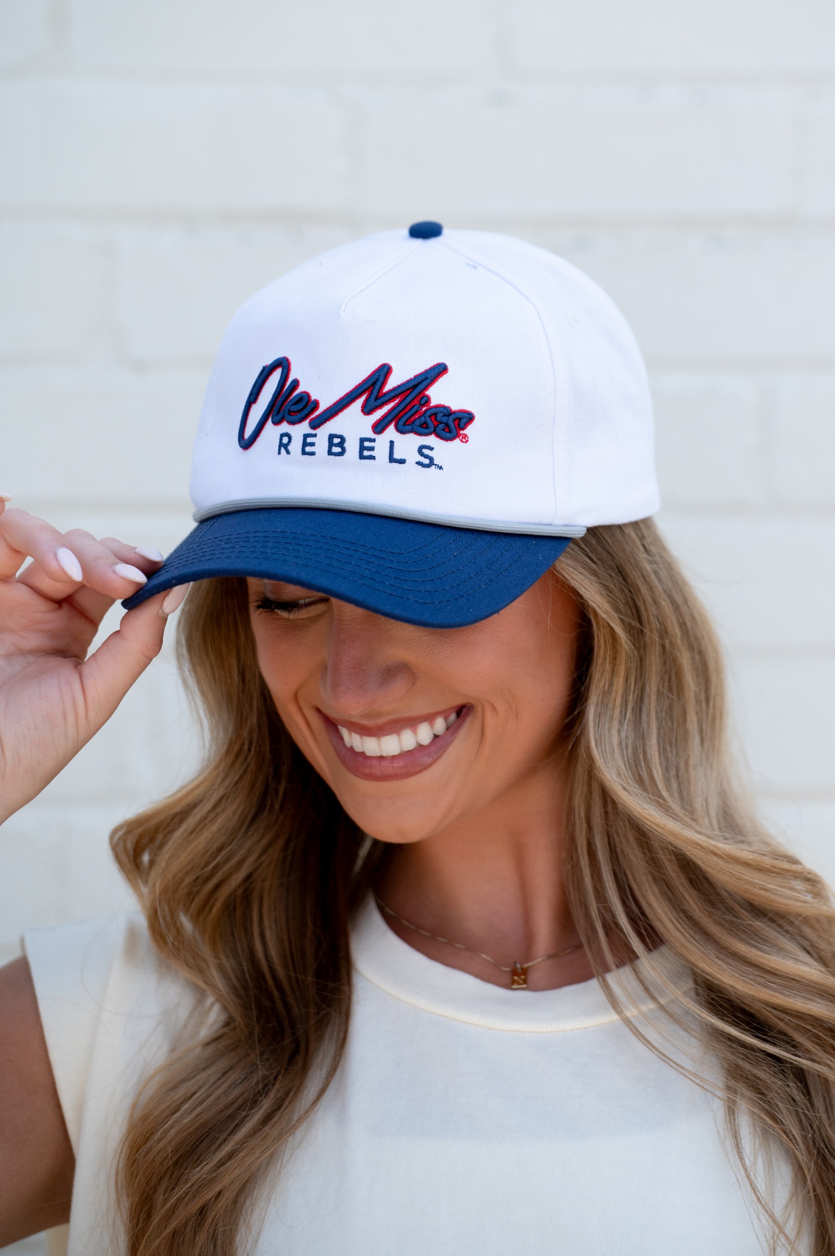 Ole Miss White and Navy Hat with Navy embroidery “Ole Miss” and Navy text “Rebels”