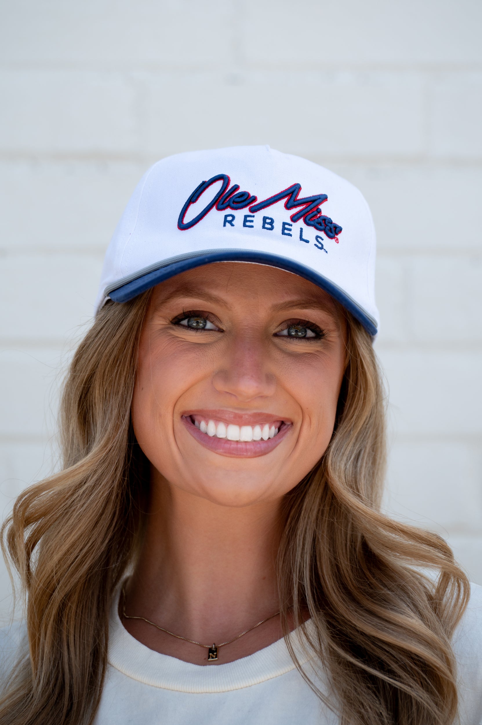 Ole Miss White and Navy Hat with Navy embroidery “Ole Miss” and Navy text “Rebels”
