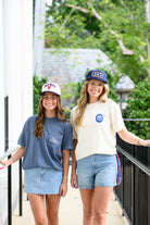 Ole Miss Cream and Navy Hat with embroidered text “Ole Miss Rebels” surrounding the Script M Logo