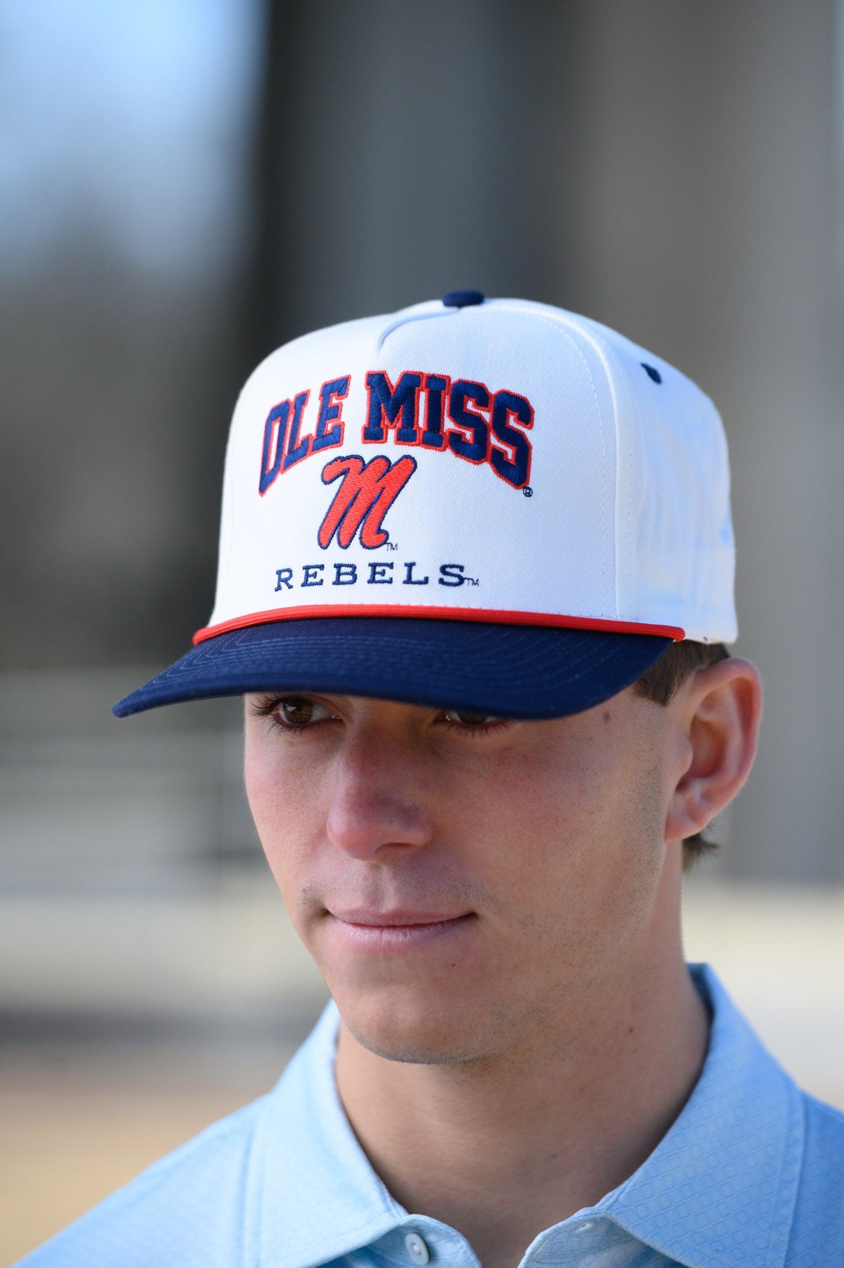 Ole Miss Cream and Navy Hat with embroidered text “Ole Miss Rebels” surrounding the Script M Logo