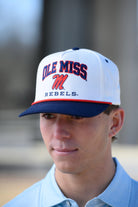 Ole Miss Cream and Navy Hat with embroidered text “Ole Miss Rebels” surrounding the Script M Logo