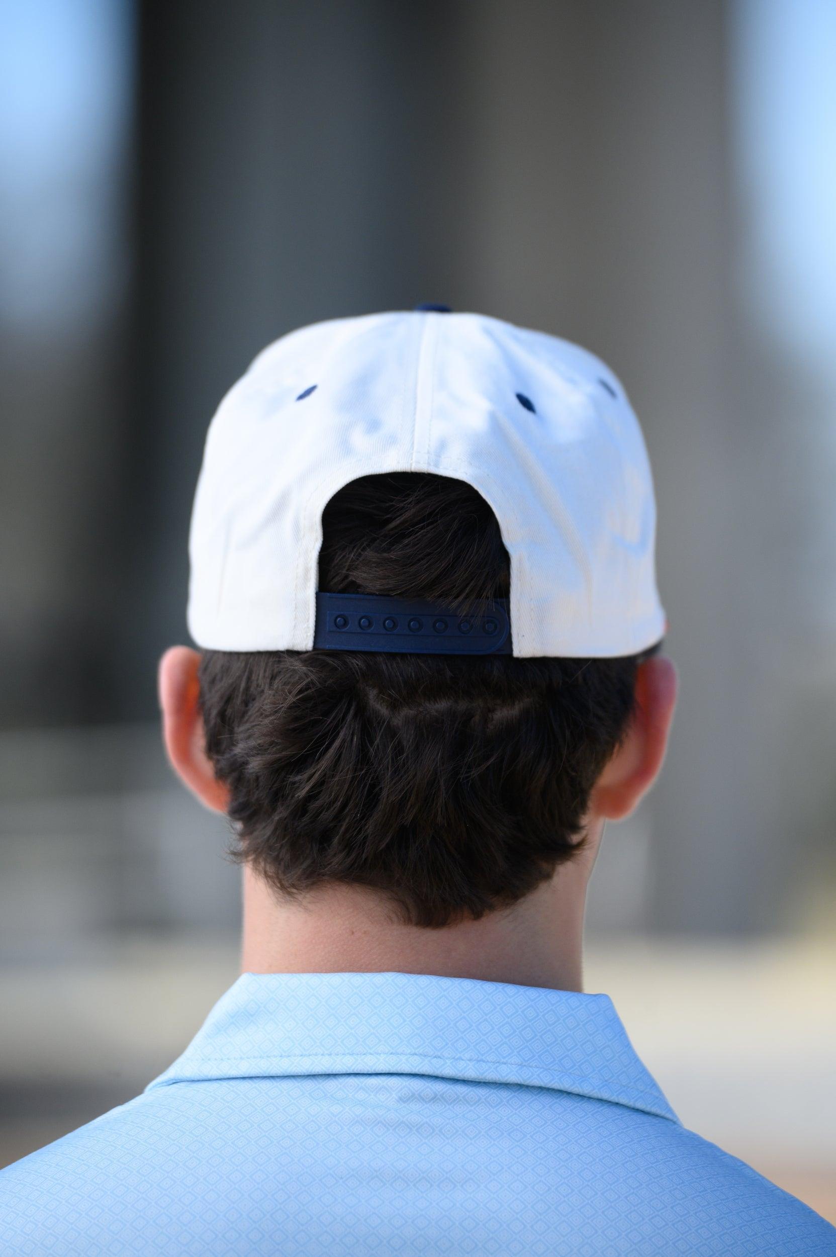 Ole Miss Cream and Navy Hat with embroidered text “Ole Miss Rebels” surrounding the Script M Logo snapack hat