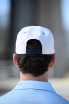 Ole Miss Cream and Navy Hat with embroidered text “Ole Miss Rebels” surrounding the Script M Logo snapack hat