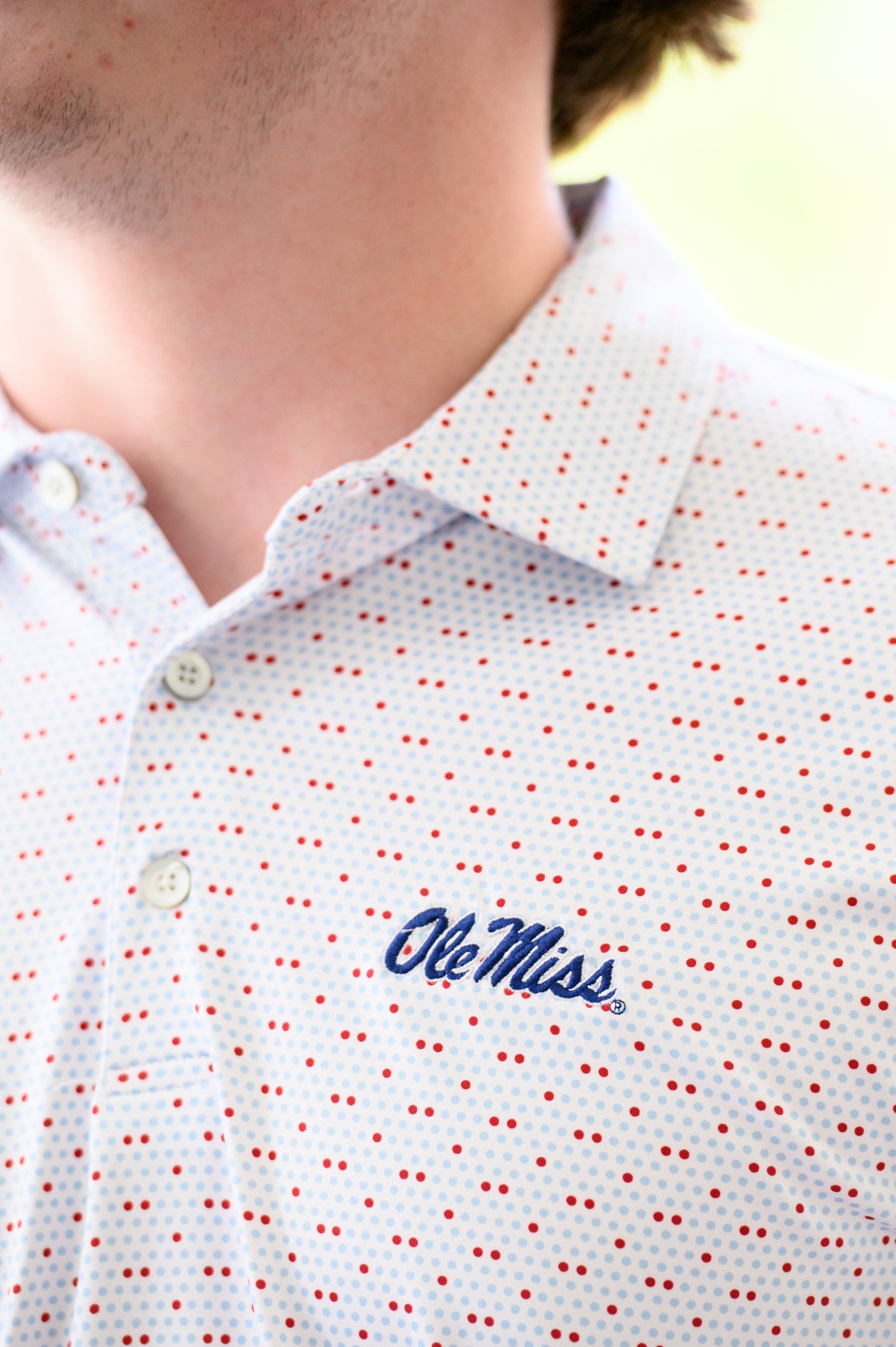Ole Miss White Men’s Polo with Red and Light Blue dots and Navy Ole Miss Logo embroidery