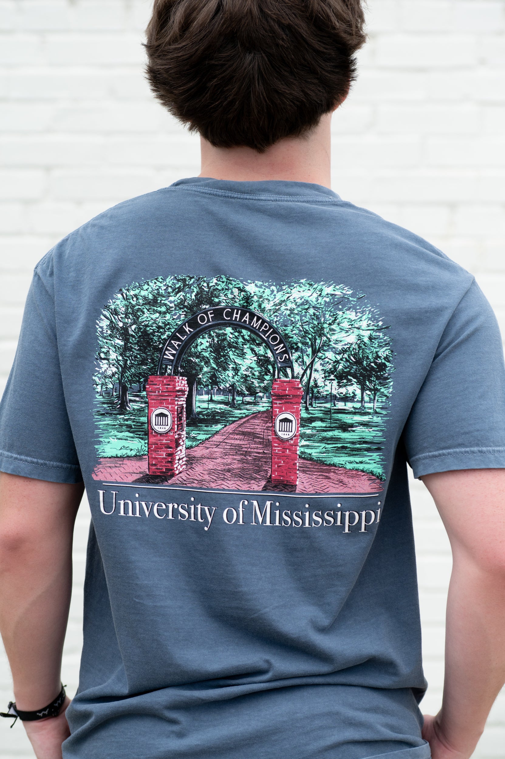 Ole Miss Dusty Navy T-Shirt with an illustration of the Mississippi University Walk of Champions
