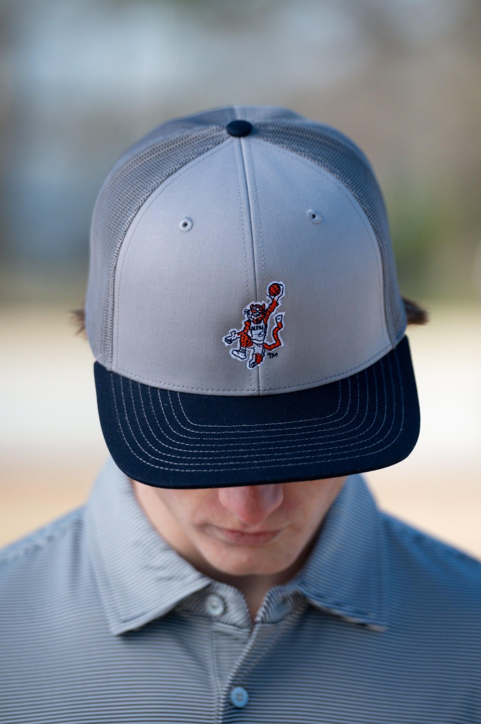 Auburn University Grey and Navy Trucker Hat with the Original Aubie basketball logo on the front, featuring a gray crown and black visor.