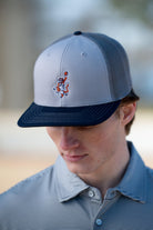 Auburn University Grey and Navy Trucker Hat with the Original Aubie basketball logo on the front, featuring a gray crown and black visor.