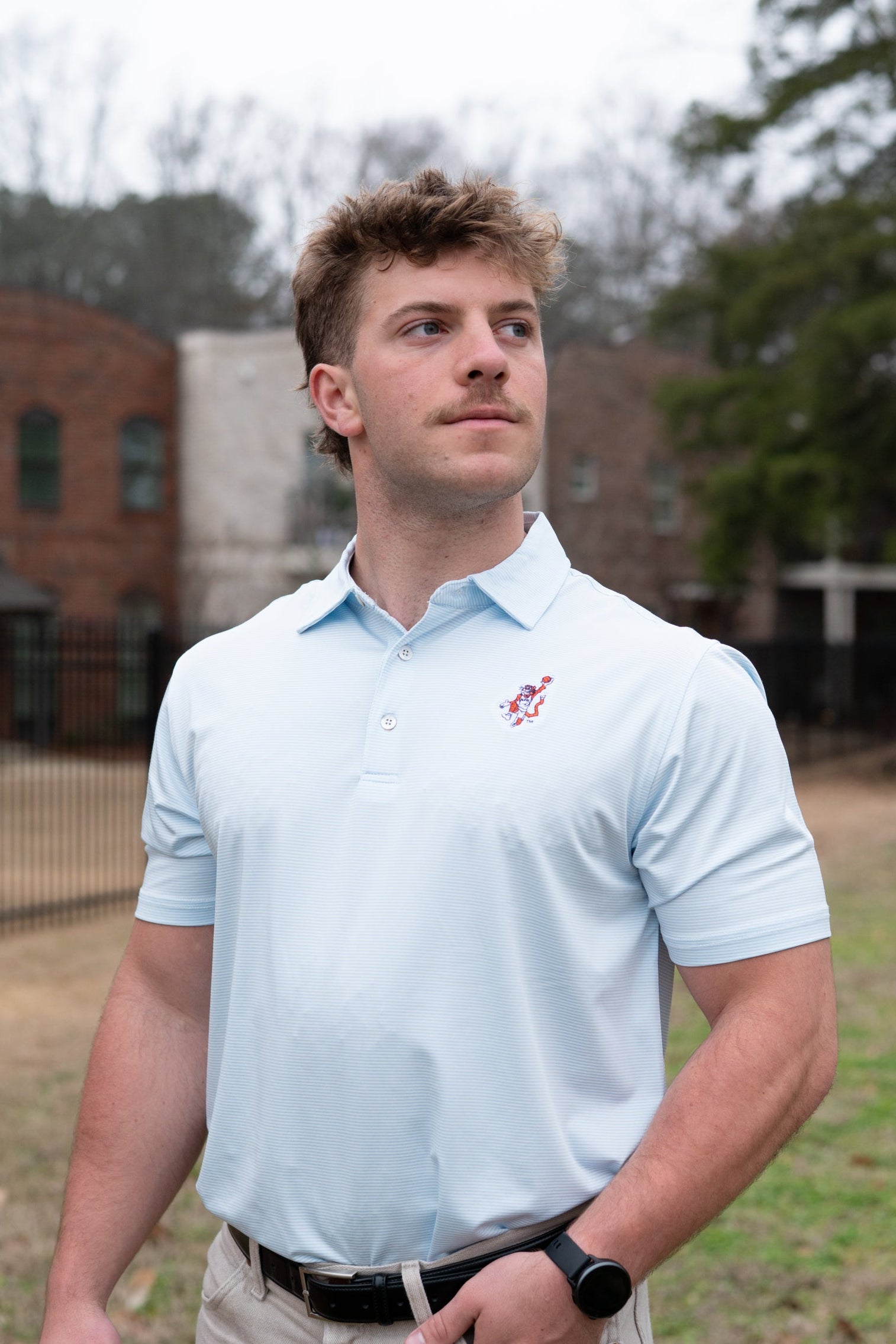 Auburn University Light Blue Men’s Stripe Polo with the Original Aubie Basketball Logo embroidery