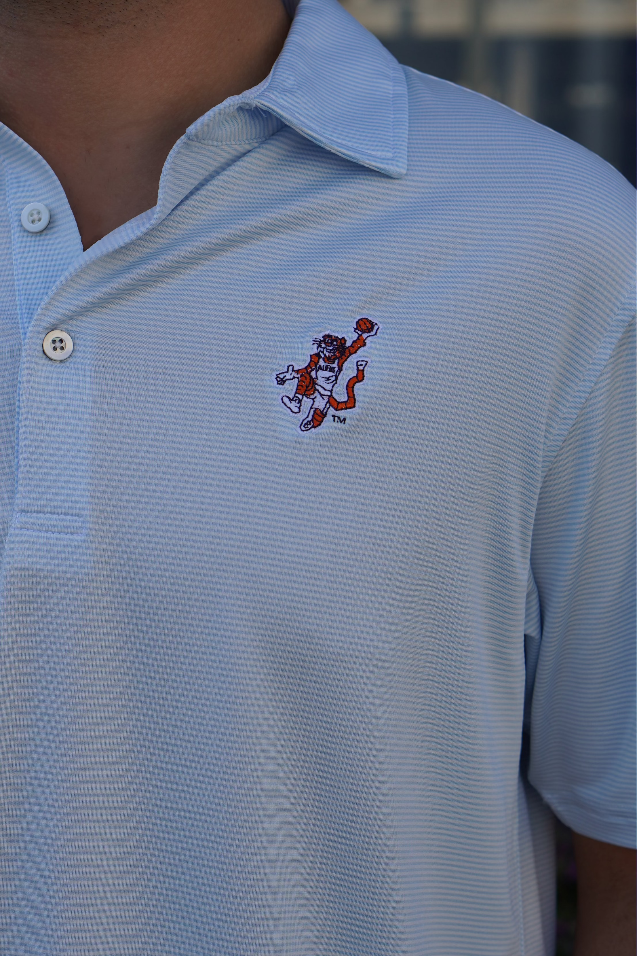 Auburn University Light Blue Men’s Stripe Polo with the Original Aubie Basketball Logo embroidery