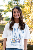 Auburn University Ivory T-Shirt with navy text “Tigers” above Aubie laying down
