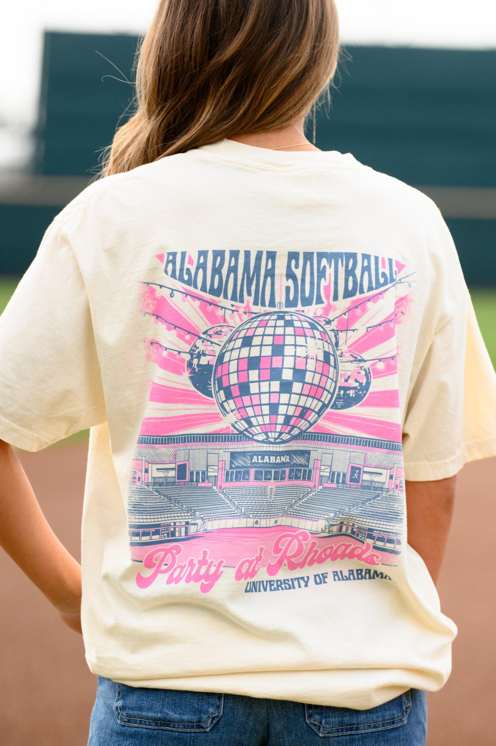 University of Alabama Ivory Ladies' T-Shirt with a hand-drawn design featuring Rhoads Stadium, disco balls, and pink, related to the Alabama Softball team.