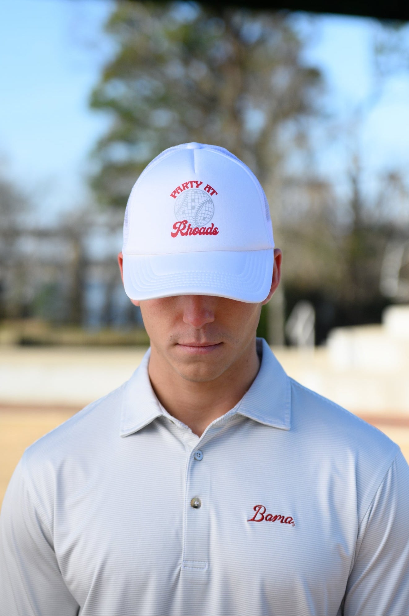 University of Alabama White Trucker Hat with Red “Party At Rhoads” text and a disco softball design in silver.