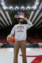 University of Alabama Heather Grey Sweatshirt with Plaid text “Alabama” above a Vintage A Logo Basketball and Red text “Basketball” underneath, with Black text “The Plaid Palace” across the bottom of the design