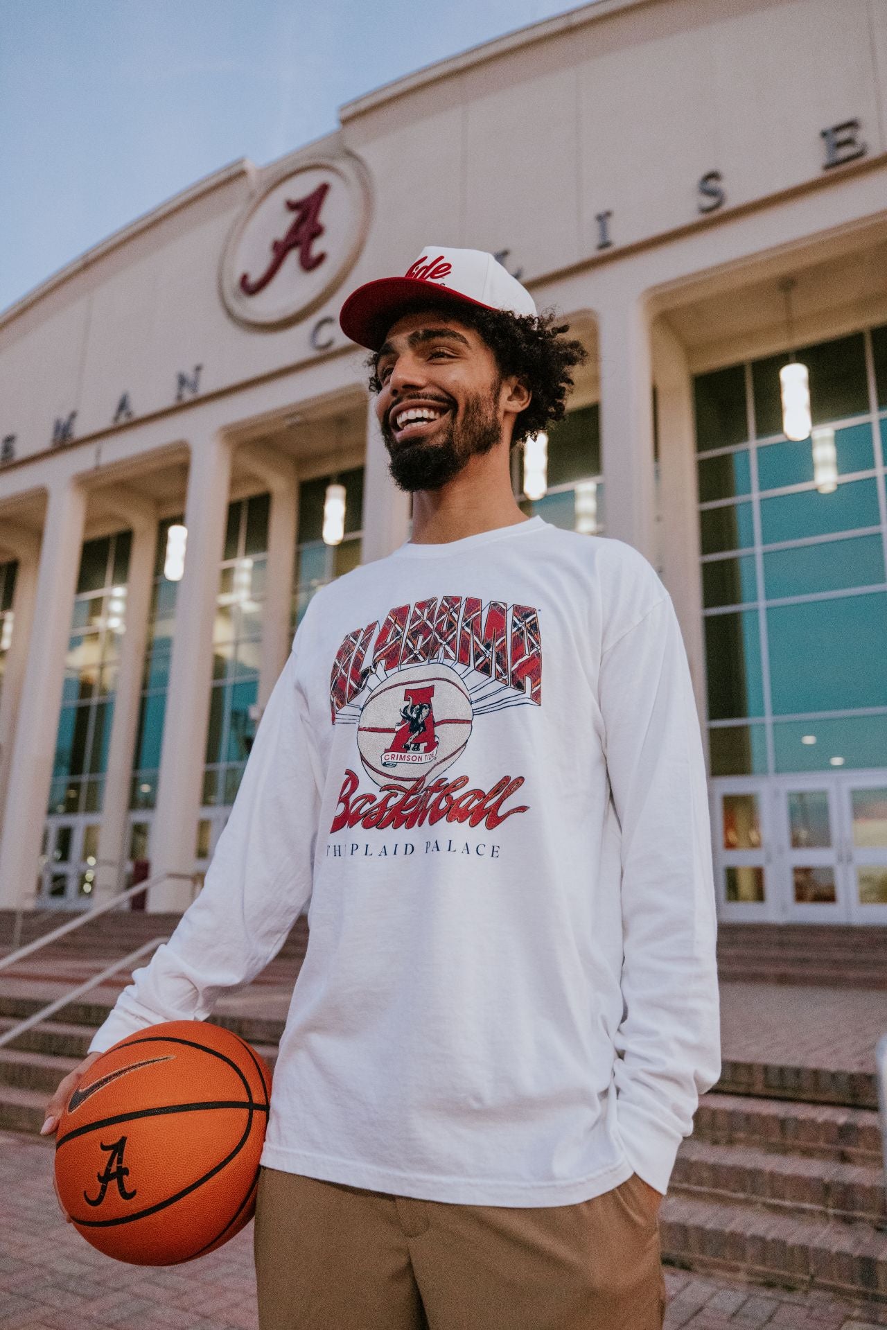 University of Alabama White T-Shirt with Plaid text “Alabama” above a Vintage A Logo Basketball and Red text “Basketball” underneath, with Black text “The Plaid Palace” across the bottom of the design