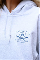 Auburn University Light Grey Distressed Hoodie Chest Design with a Navy print of home plate over two crossed baseball bats