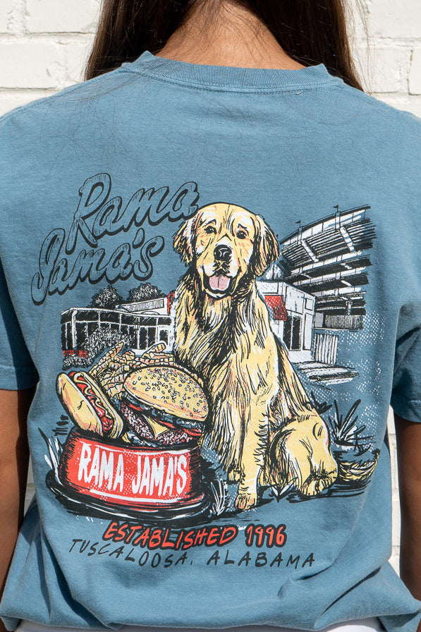 Person wearing a blue t-shirt with a graphic of a dog and hot dogs, featuring 'Rama Jim's' branding.