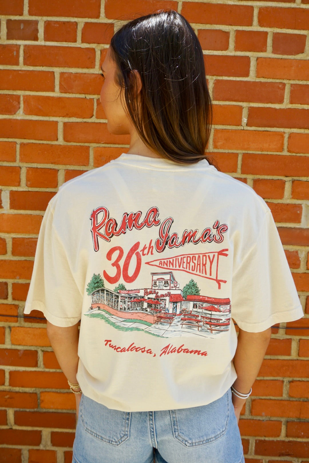 Rama Jama’s Ivory T-Shirt with the Rama Jama’s Building under Red text “Rama Jama’s 30th anniversary” with “anniversary” inside a pennant flag
