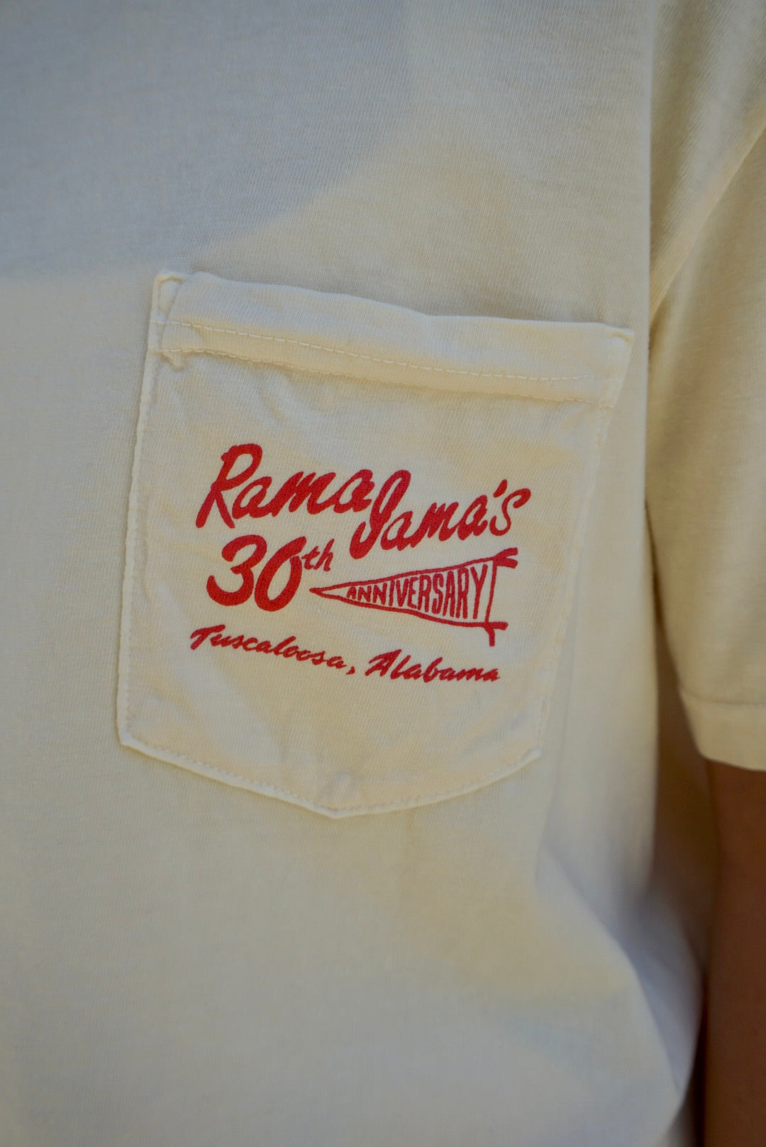 Front Pocket with Red text “Rama Jama’s 30th anniversary” with “anniversary” inside a pennant flag