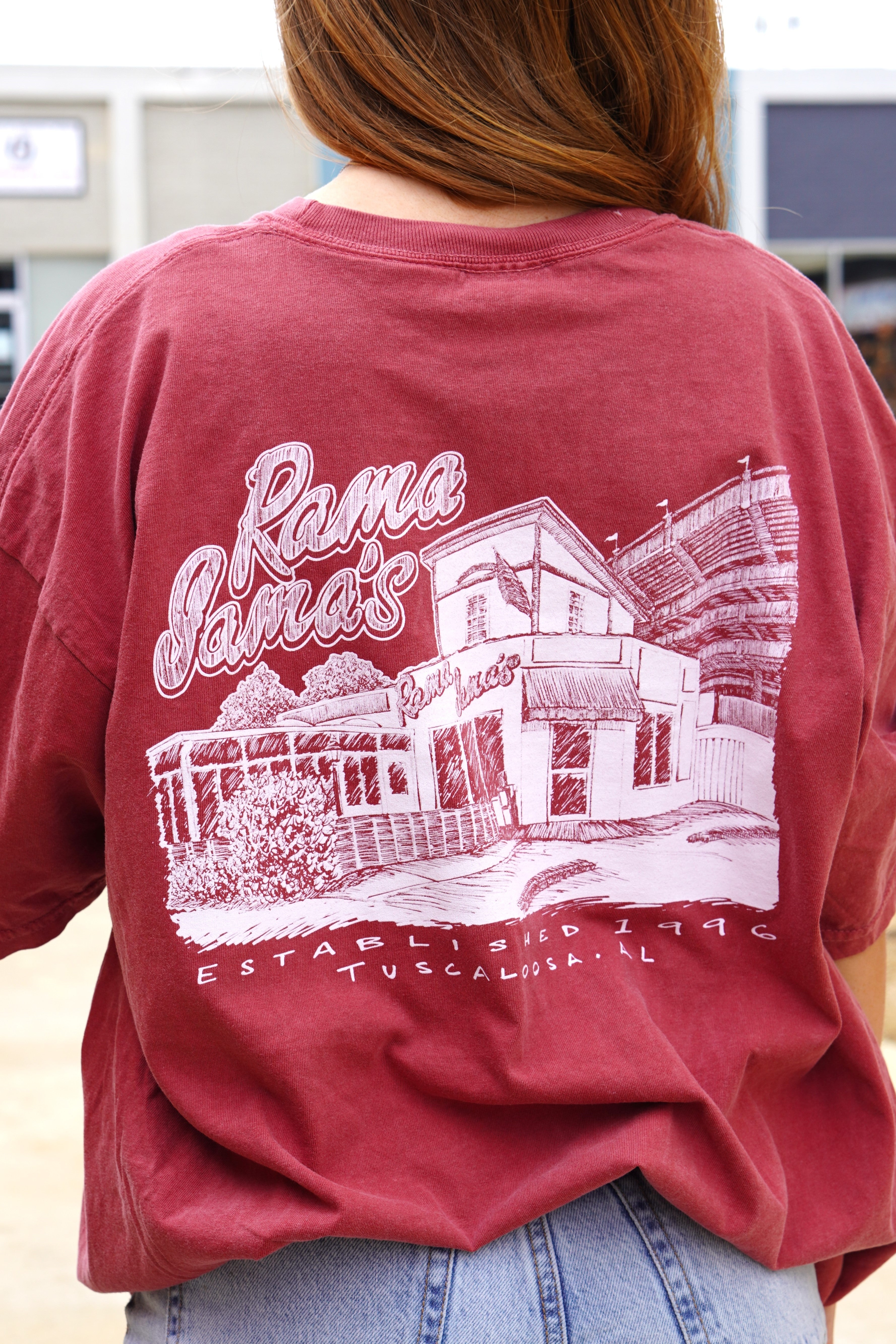 Rama Jama's Red Tee with a White illustration of the Rama Jama's Building 