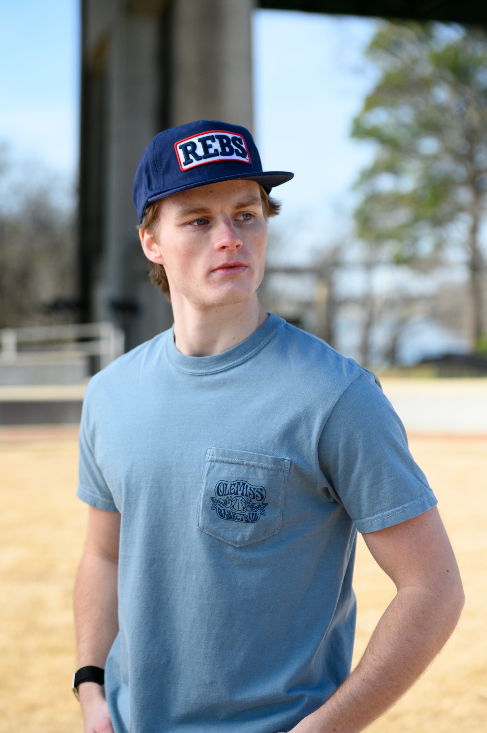 Ole Miss Blue T-Shirt with an "Ole Miss Basketball" front pocket design