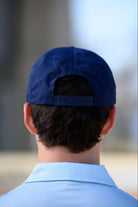 Ole Miss Navy Snapback Hat featuring a White patch with Navy “REBS” embroidery snapback hat
