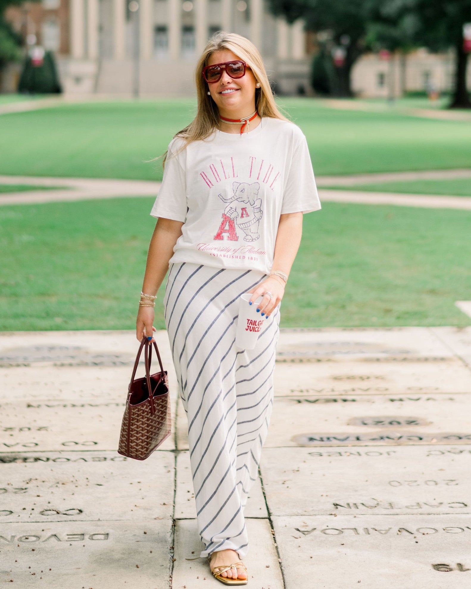 University of Alabama Ivory T-Shirt with Red text “Roll Tide” above an image of Big Al leaning on a Black A