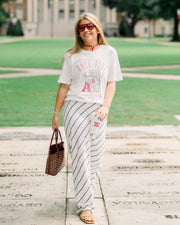 University of Alabama Ivory T-Shirt with Red text “Roll Tide” above an image of Big Al leaning on a Black A