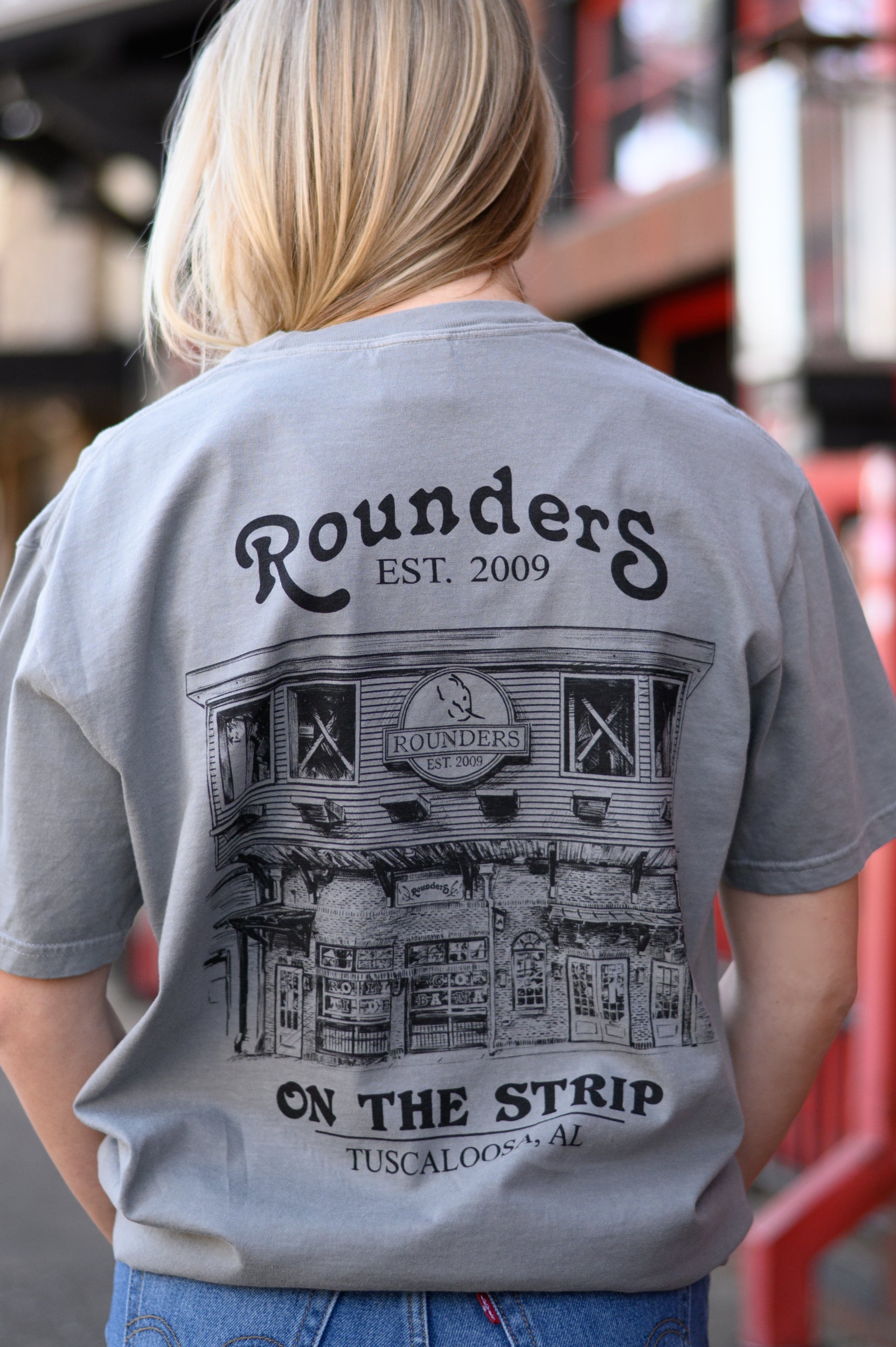 Rounders Grey Tee with a Black illustration of the Rounders Building