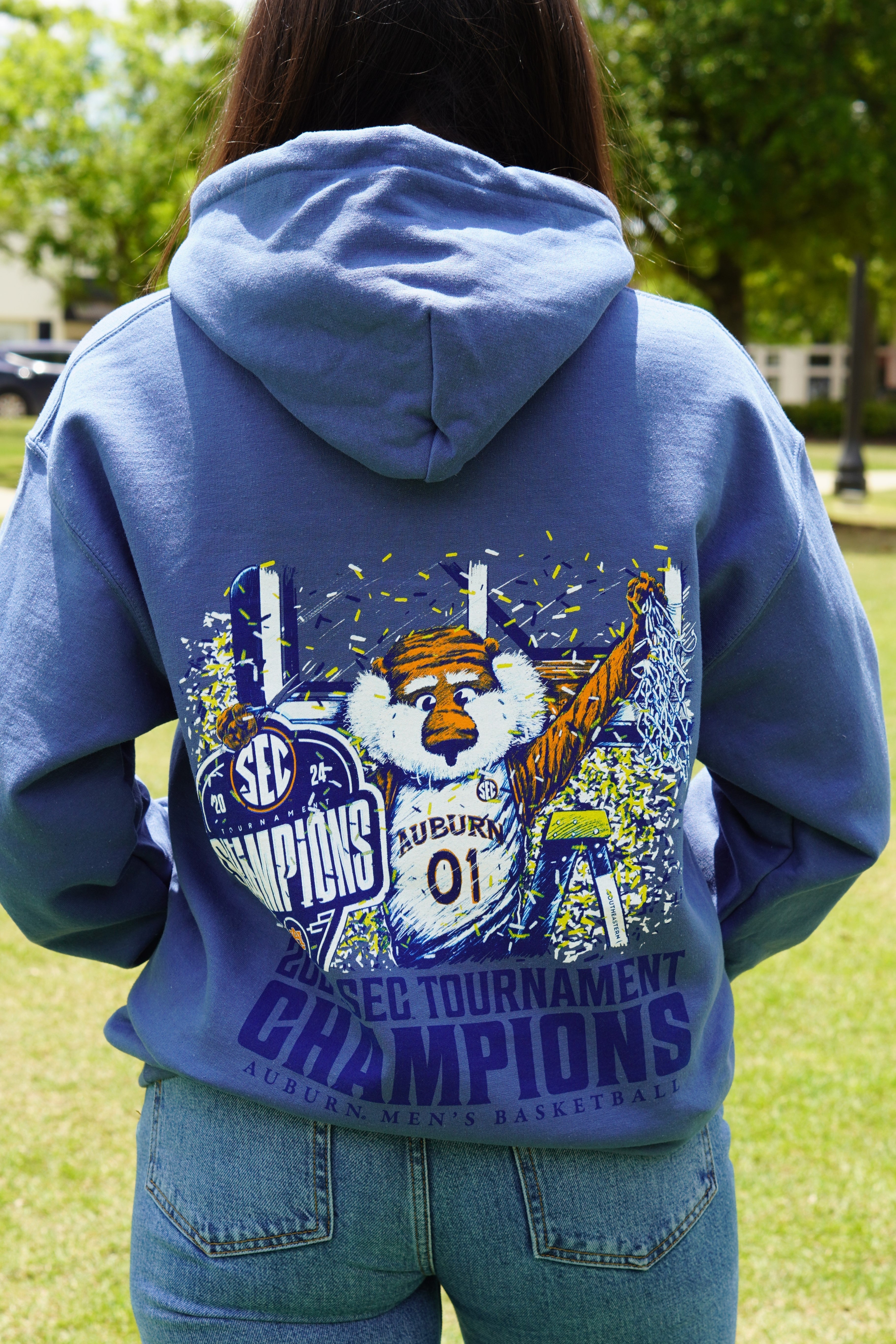 Auburn University Blue SEC Champions  Hoodie with an illustration of Aubie holding an "SEC Champions" sign while confetti pours down around him