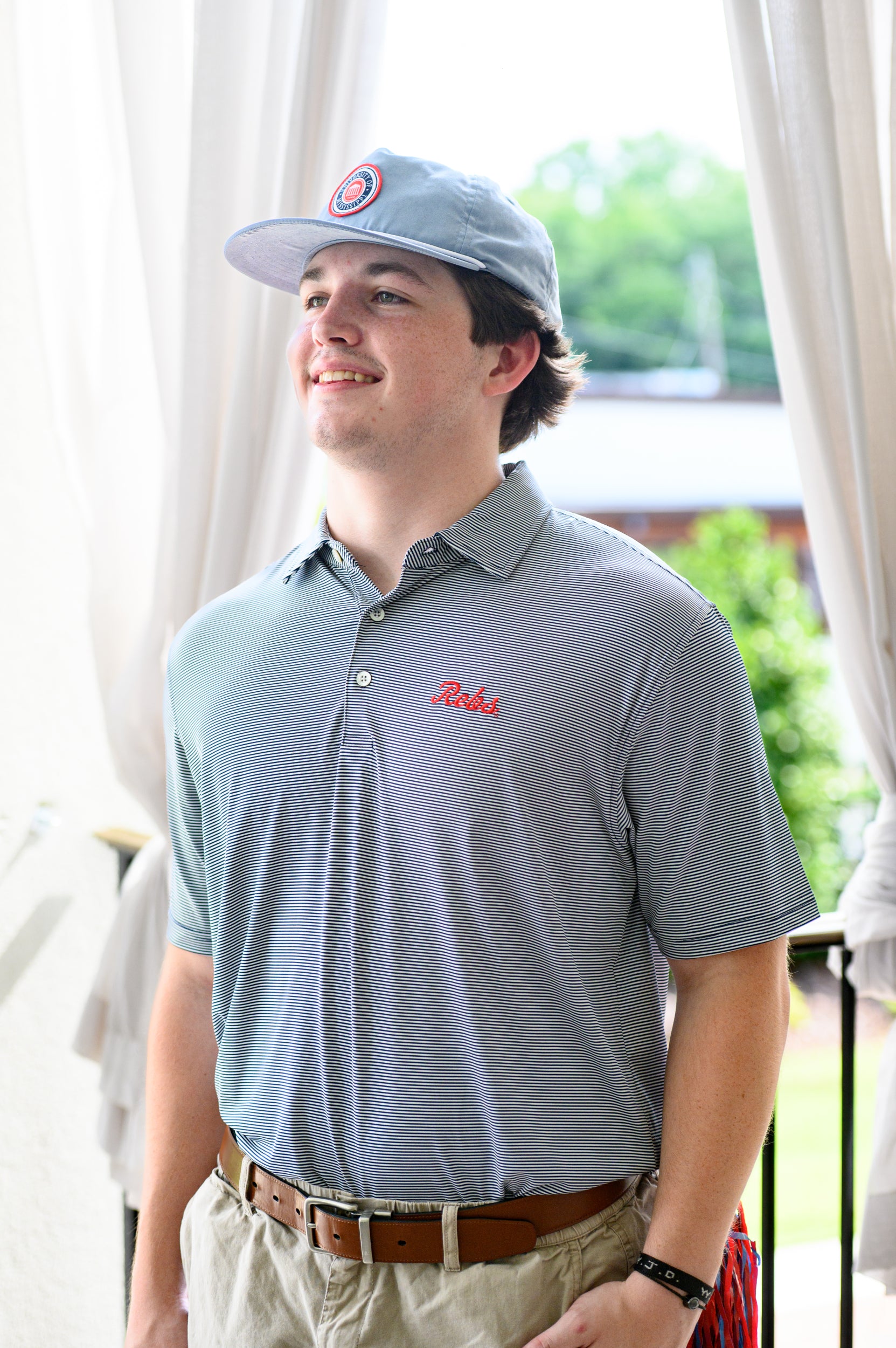 Ole Miss Navy Men’s Stripe Polo with the Script Rebs Logo embroidery