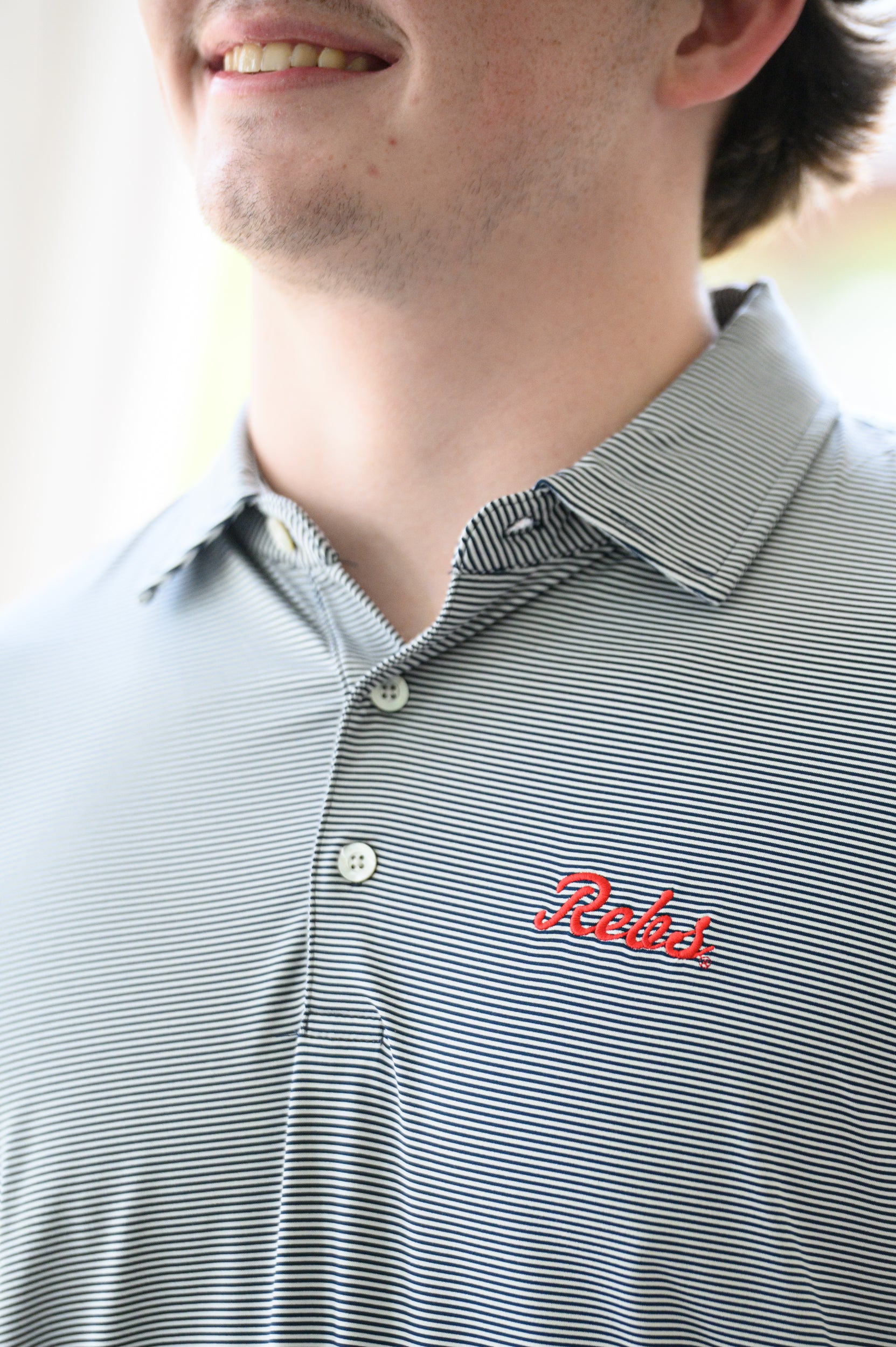 Ole Miss Navy Men’s Stripe Polo with the Script Rebs Logo embroidery