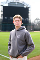 University of Alabama Light Grey Distressed Hoodie Chest Design with a white print of home plate over two crossed baseball bats