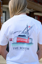 The Booth White T-Shirt featuring an illustration of a bottle attached to a boat next to script text “Slippery” 