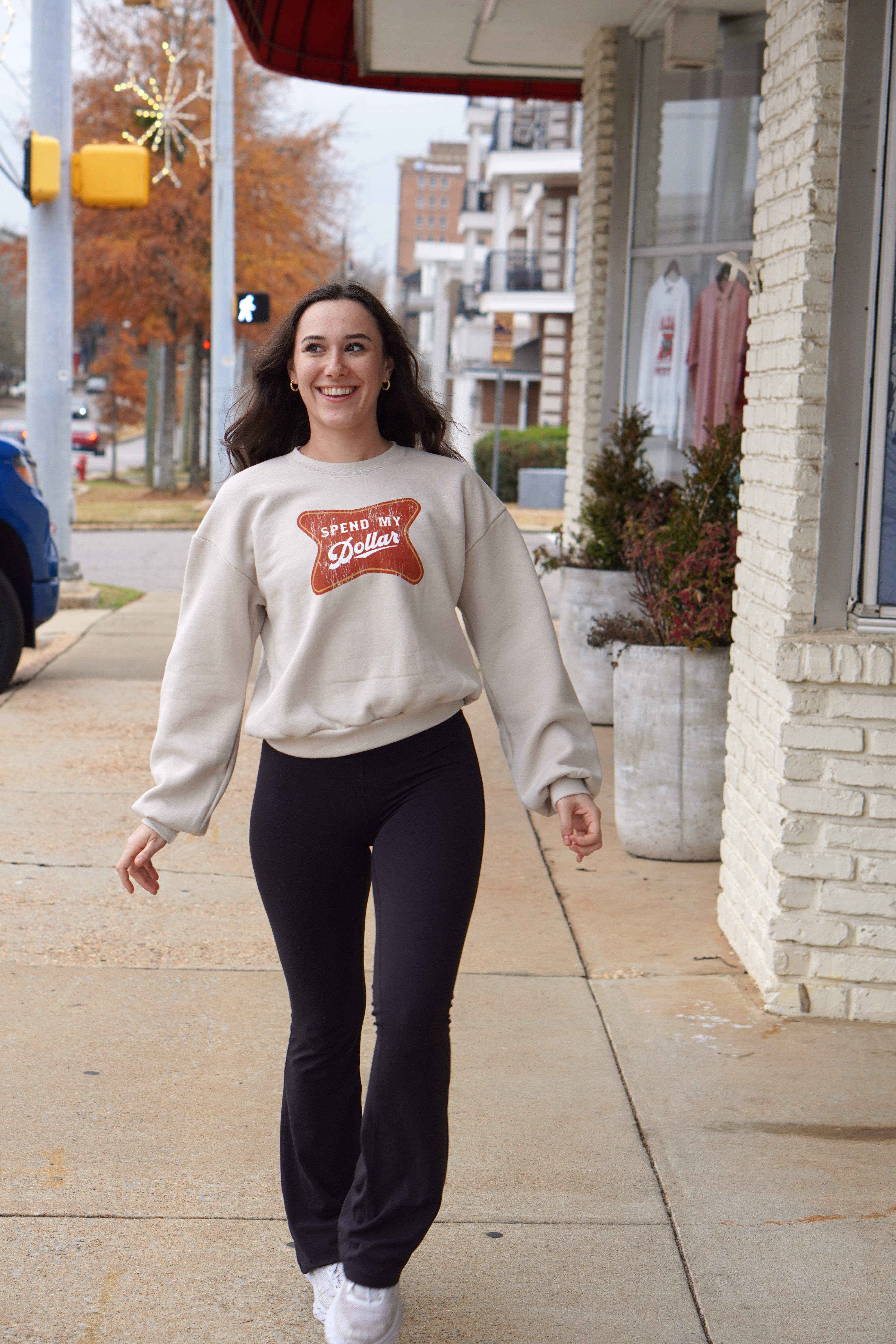 University of Alabama Bone Ladies' Crewneck featuring a Red sign with White text "Spend My Dollar"
