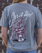 University of Alabama Grey T-Shirt with White text “Stir it Up!” above a stadium cup with a Red and White shaker inside 