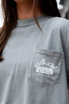  University of Alabama Grey T-Shirt  Pocket Design with White text “stir it up” over the Bryant-Denny Stadium