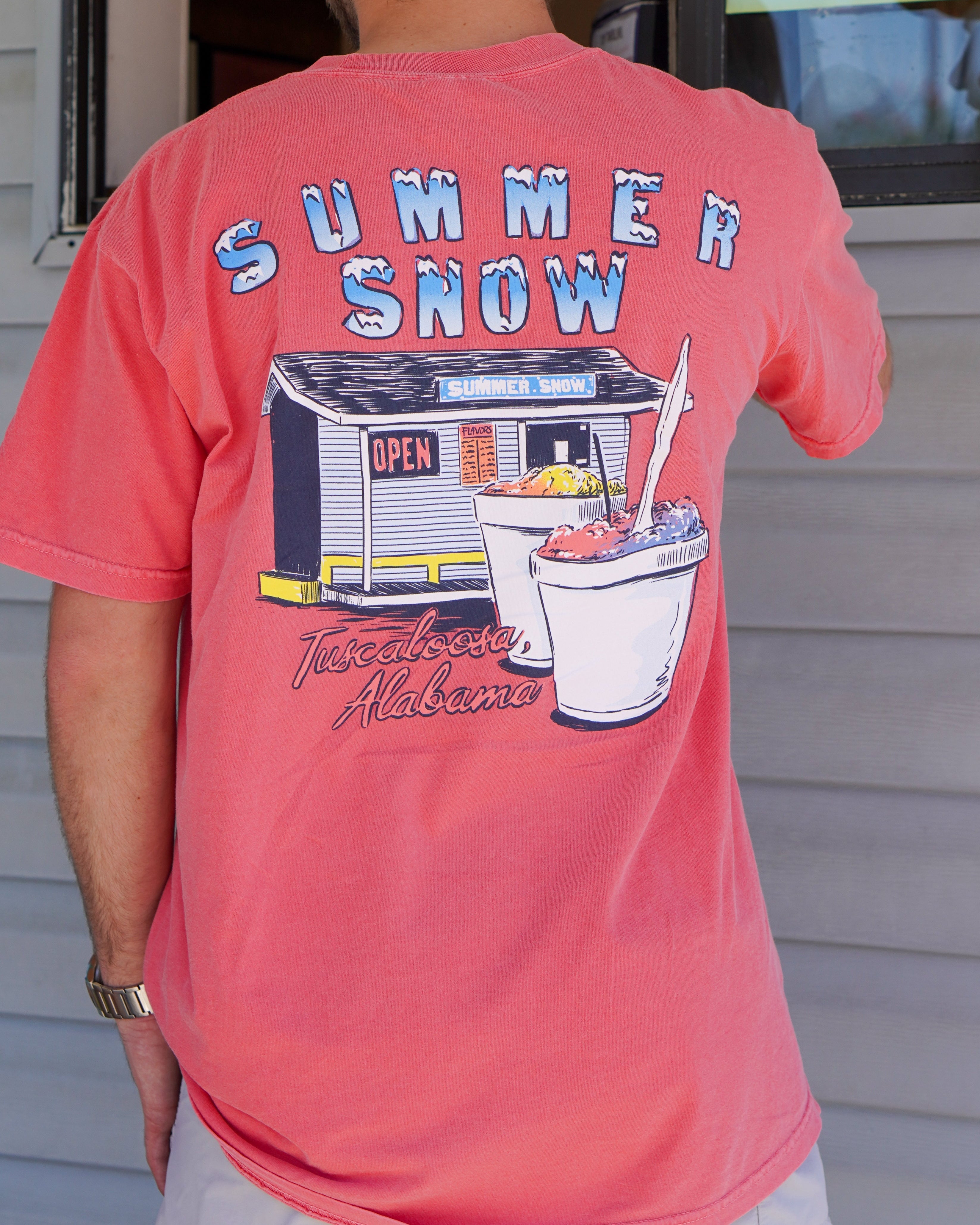 Summer Snow Watermelon T-Shirt with the Summer Snow logo above an image the Summer Snow building with two snow cones