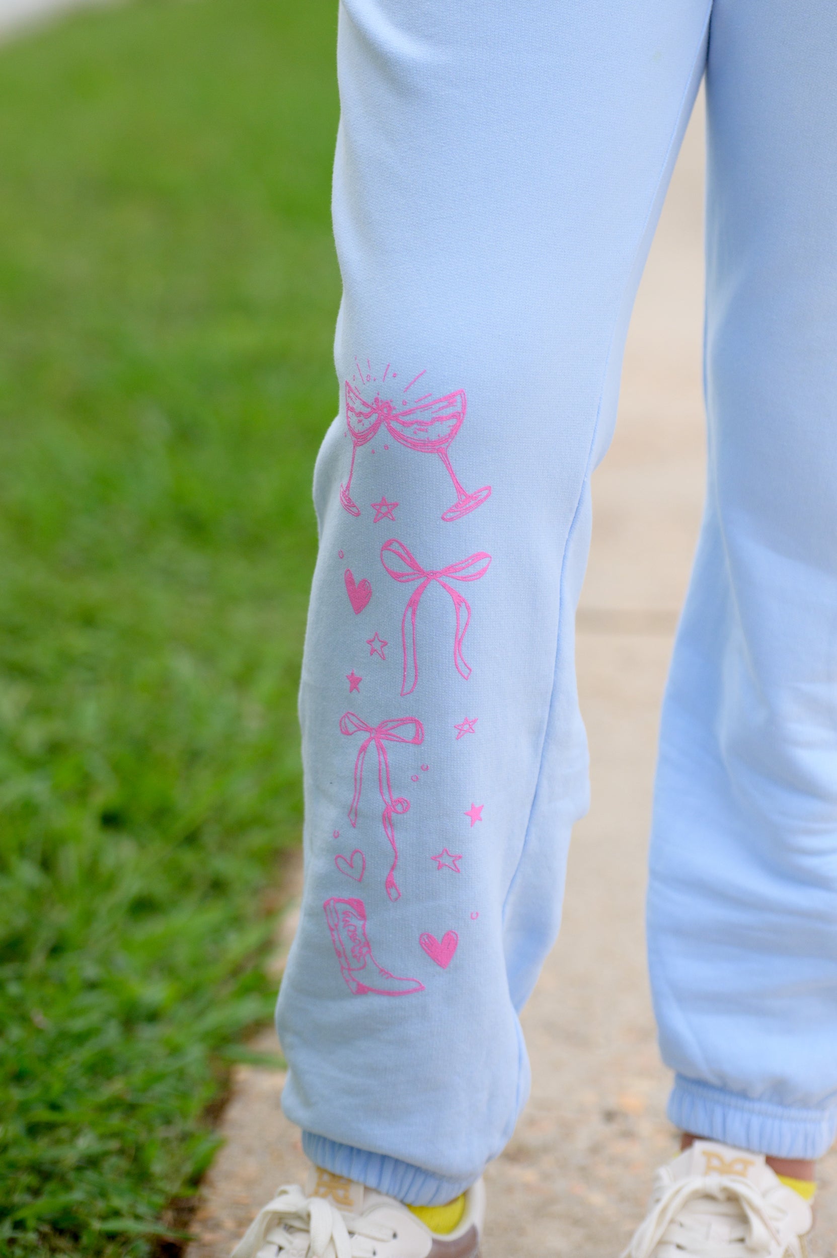 T-Town Lifestyle Sweatpants with Pink illustrations of hearts, bows, stars, etc.