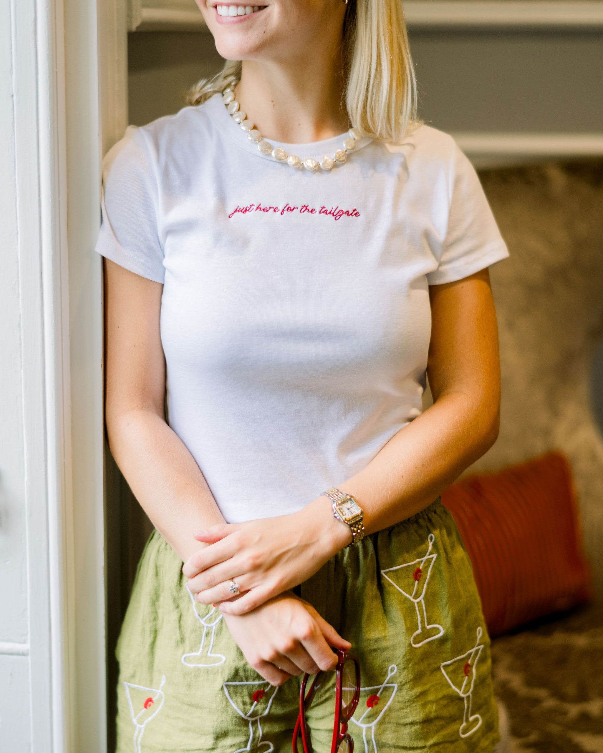 University of Alabama White Baby Tee with Red script “just here for the tailgate”